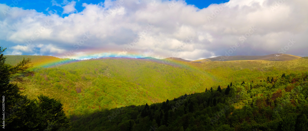 Landscape of Mavrovo national park with rainbow, mountain and lake, FYR Macedonia