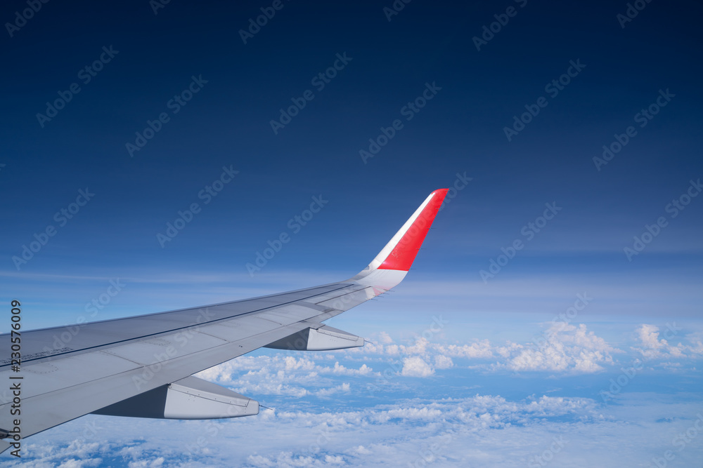 Fototapeta premium Beautiful view from airplane window and blue sky on nice sunny day, This time in altitude during flight.
