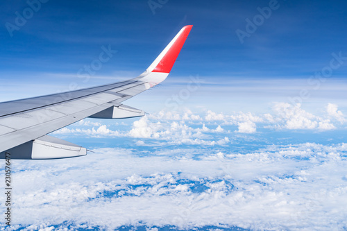 Beautiful view from airplane window and blue sky on nice sunny day, This time in altitude during flight.