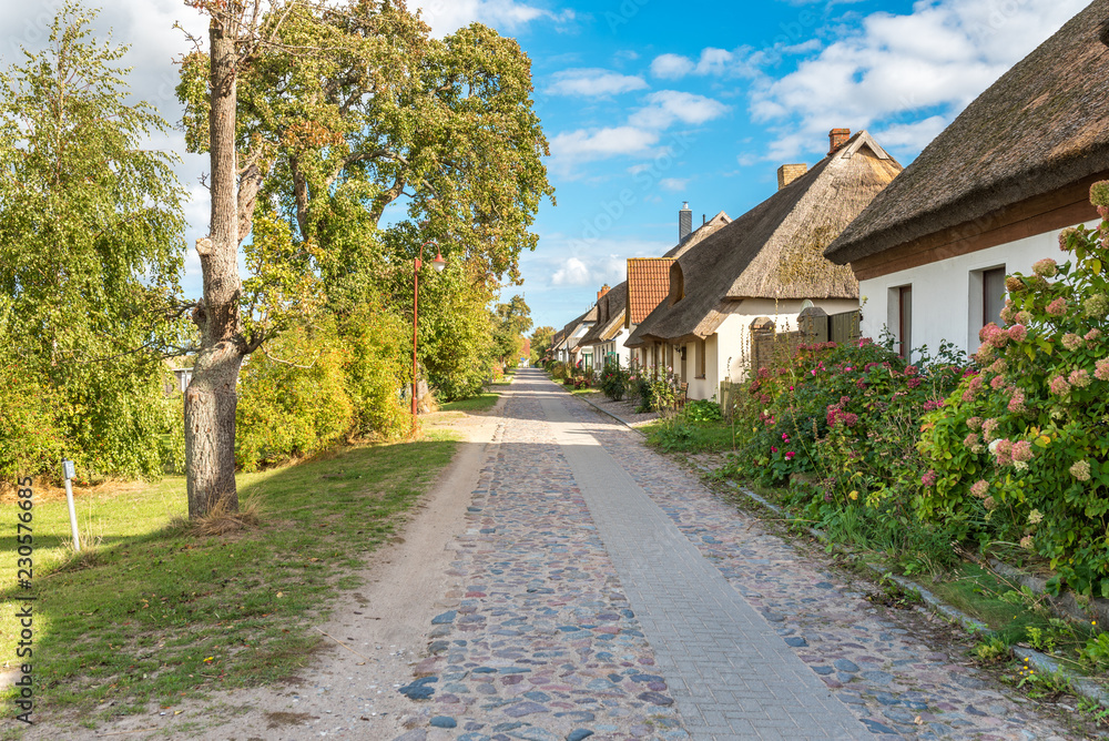 Village road in the picturesque fishing village Neu Reddevitz on the Rügen island in the north east of Germany