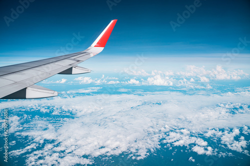 Beautiful view from airplane window and blue sky on nice sunny day, This time in altitude during flight.