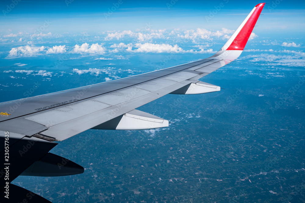 Beautiful view from airplane window and blue sky on nice sunny day, This time in altitude during flight. Beautiful view from airplane window and blue sky on nice sunny day, This time in altitude during flight.