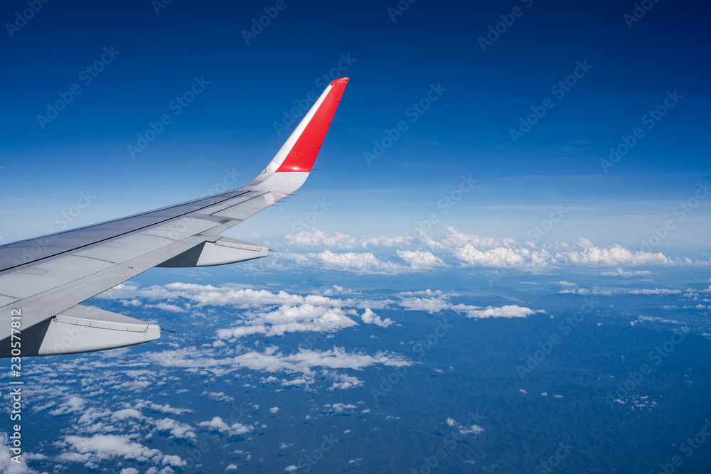 Beautiful view from airplane window and blue sky on nice sunny day, This time in altitude during flight. Beautiful view from airplane window and blue sky on nice sunny day, This time in altitude during flight.