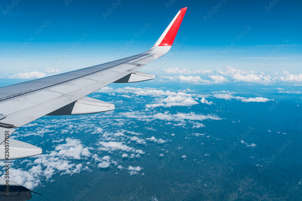 Beautiful view from airplane window and blue sky on nice sunny day, This time in altitude during flight. Beautiful view from airplane window and blue sky on nice sunny day, This time in altitude during flight.