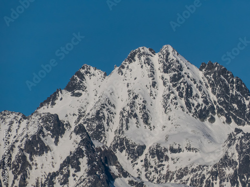 Snow mountains. Panorama of High Tatras. Snow mountains and blue sky.