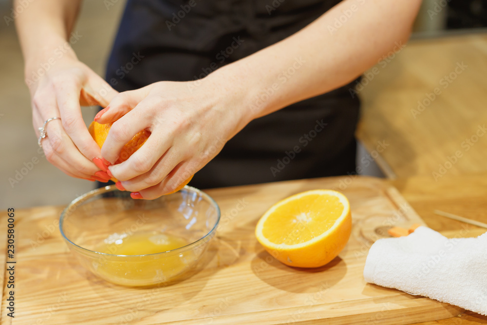 close-up scene of squeezing oranges on kitchen selective focus close-up scene of squeezing oranges on kitchen selective focus