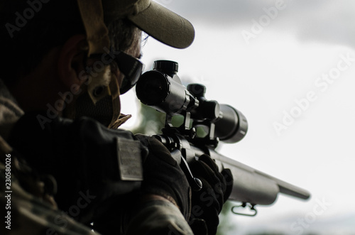 Obraz na plátně Camouflage wrap tape on sniper rifle and scope close up