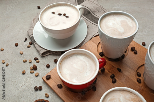 Fototapeta Naklejka Na Ścianę i Meble -  Many cups with tasty aromatic coffee on grey table
