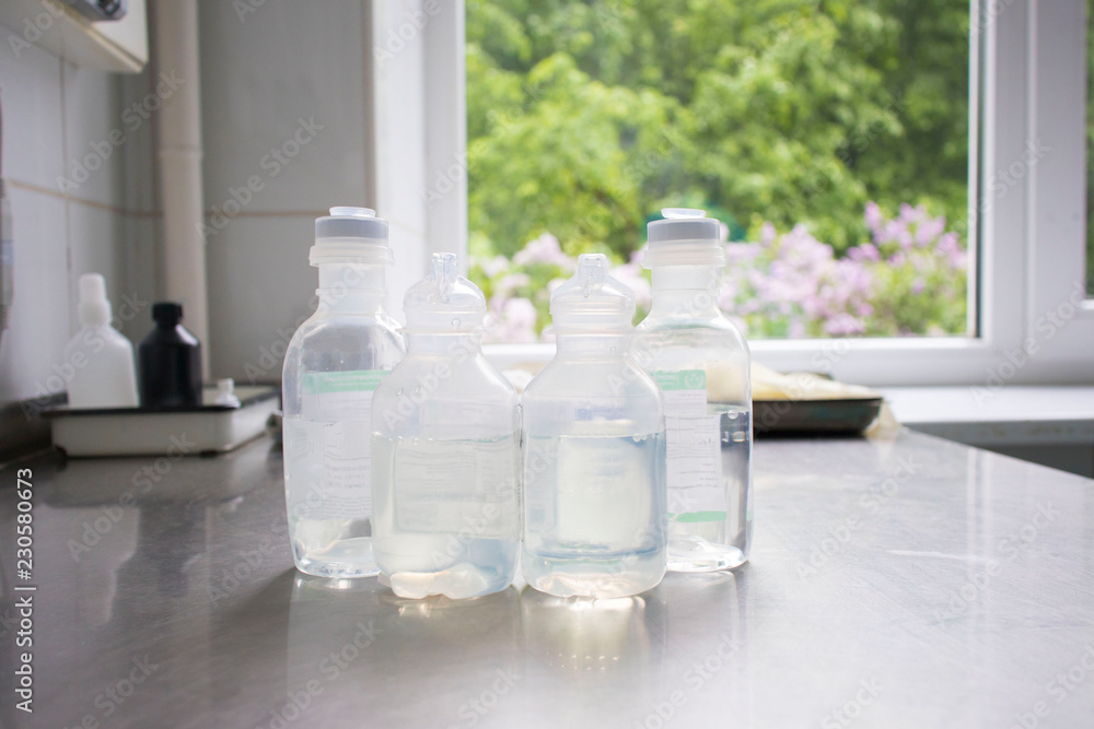 bottles with solutions on the medical table bottles with solutions on the medical table