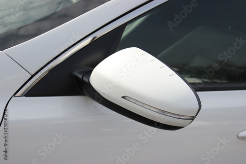 Car mirror and windows from the door side. White car part