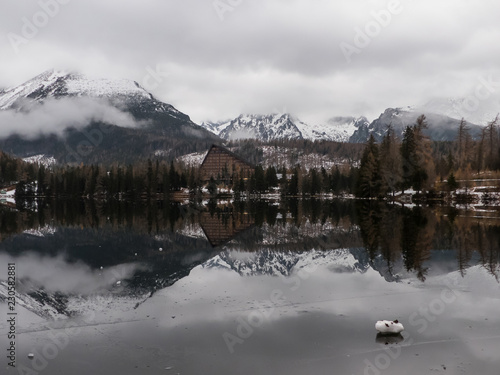 Mirror on the lake. Mirroring on Strbské Pleso in the High Tatras. Mirroring in mountains.