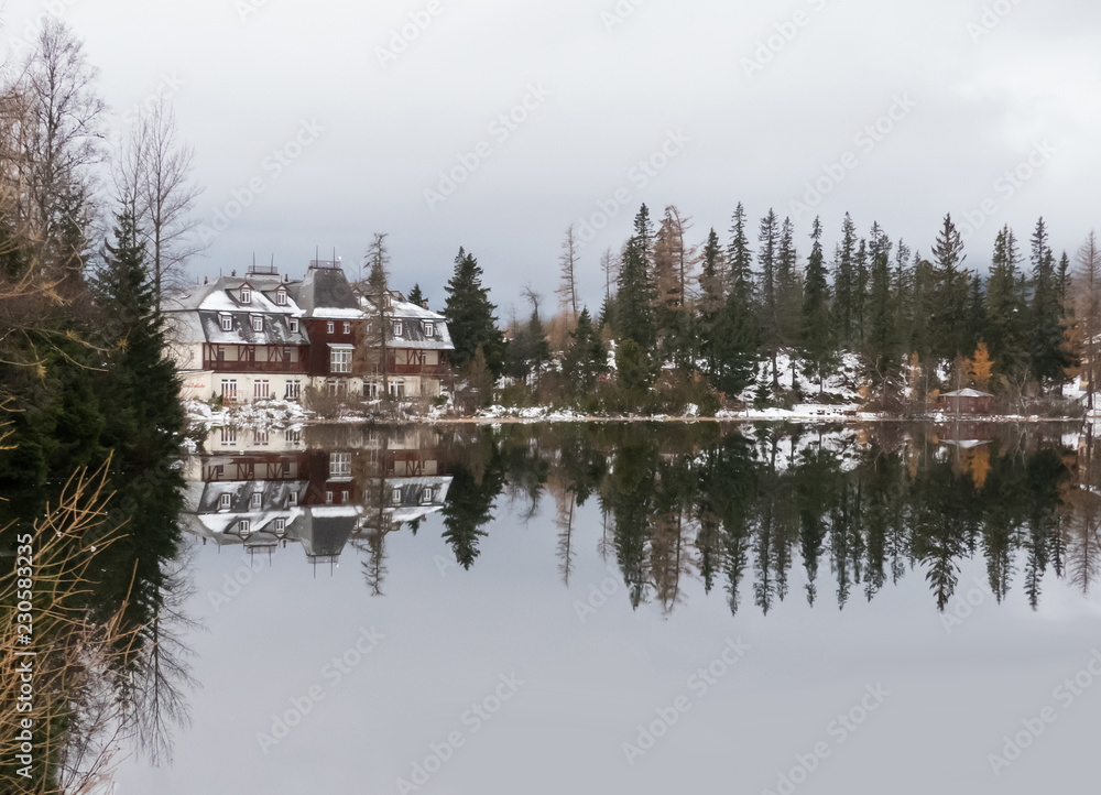Mirror on the lake. Mirroring on Strbské Pleso in the High Tatras. Mirroring in mountains. Mirror on the lake. Mirroring on Strbské Pleso in the High Tatras. Mirroring in mountains.