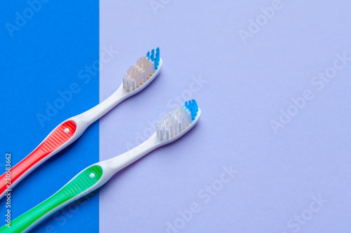 Flat lay composition with manual toothbrushes on color background  close up