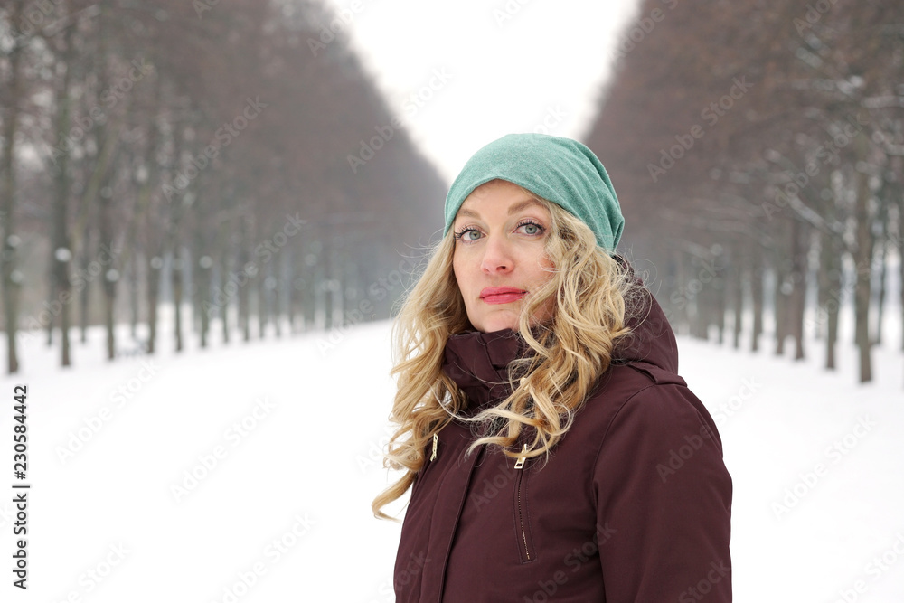 woman in snow covered alley with copy space woman in snow covered alley with copy space