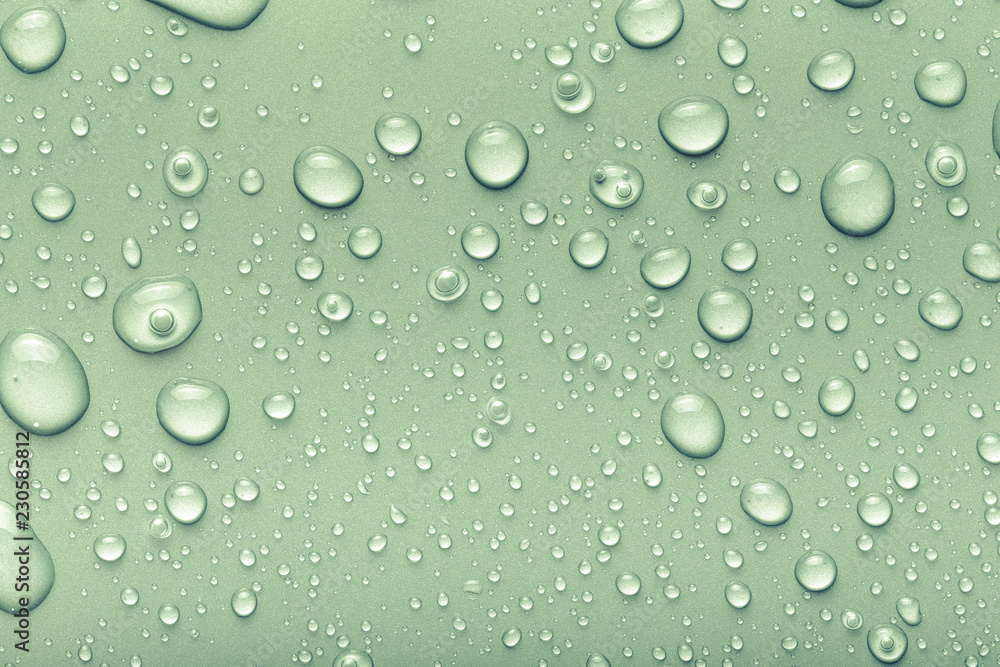 Drops of water on a color background. Green. Toned Drops of water on a color background. Green. Toned