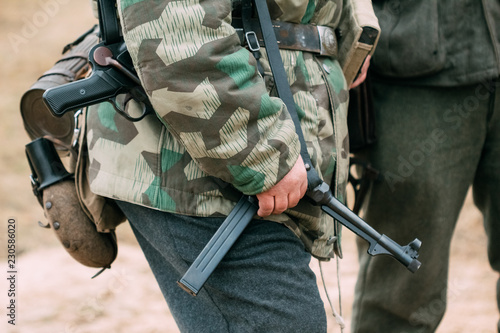 Weapons in the hands of the German Wehrmacht soldier. Reconstruc photo