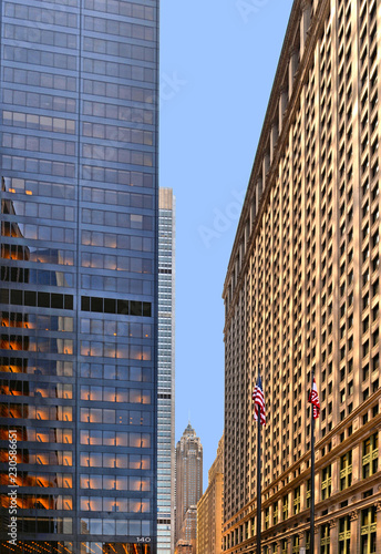 a glimpse of modern urban architecture with the particular perspective in a narrow street amid futuristic skyscrapers in the lower Manhattan, wall street and financial district. New York