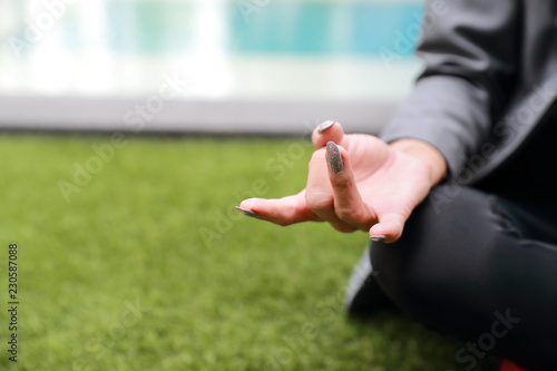 portrait of business woman hand doing yoga outdoor © feeling lucky