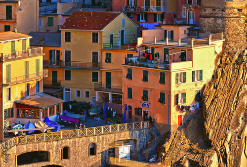 colorful houses, tourists and old facade in small village Manarola Cinque terre in liguria, italy