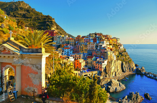Areal view on local cemetery and colorful houses and old facade in small coastal village Manarola with mediterranean sea in background. Cinque terre in liguria, italy