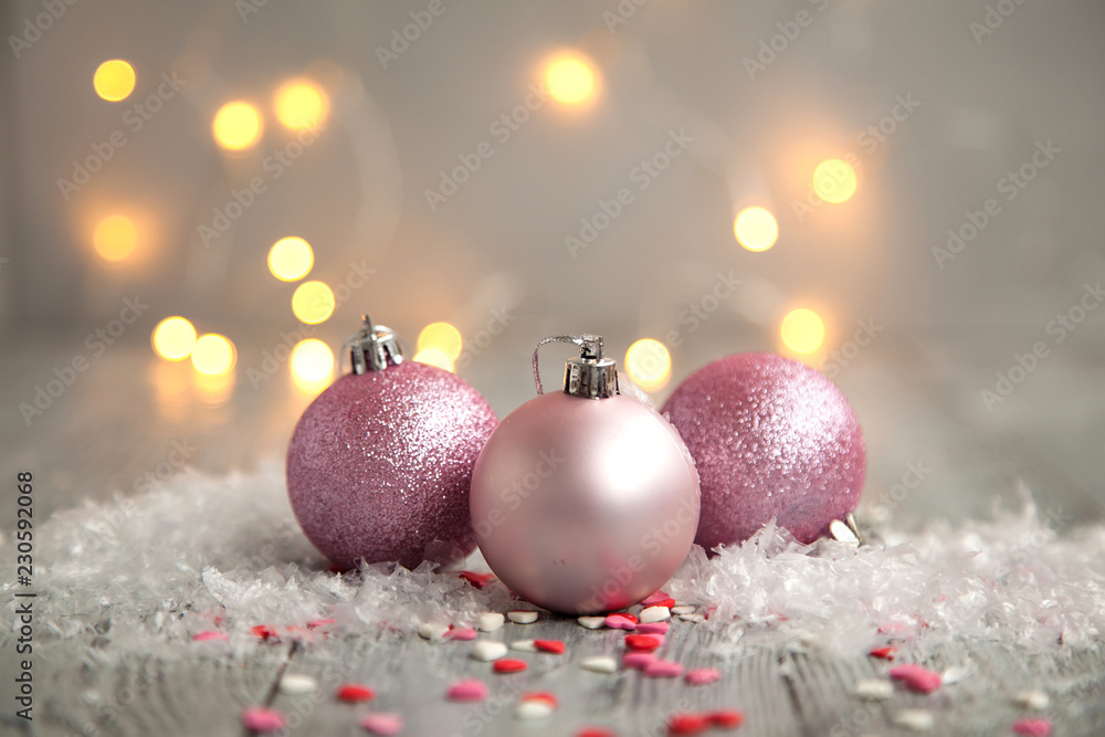 Three christmas ball in a snow on a wooden background. Holiday concept Three christmas ball in a snow on a wooden background. Holiday concept
