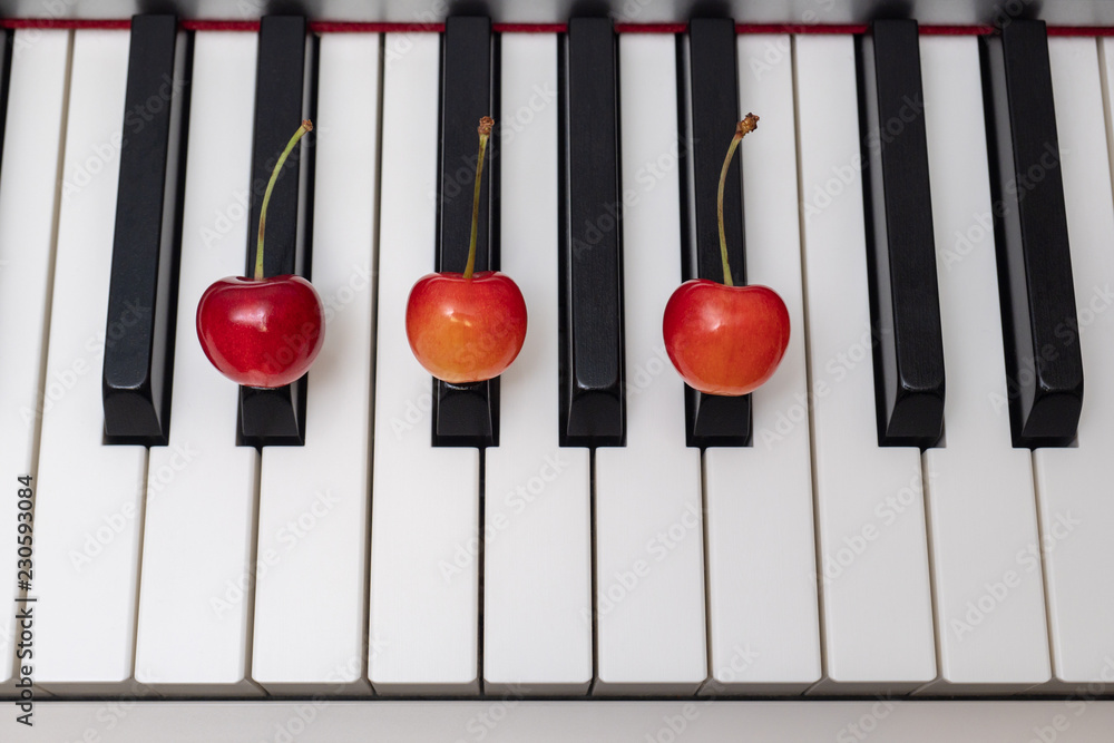 Piano chord D#m (D sharp minor) / Ebm (E flat minor) shown by cherries on  the key - 4/12 of minor series Stock Photo | Adobe Stock