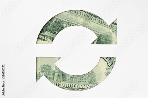 Circle arrows made of dollar banknotes -  Money circulation concept photo