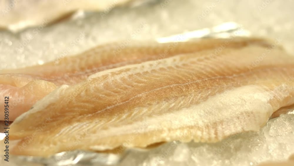 Pangasius fillet. Seafood.
Fresh pangasius fillet is laid out on ice.
Horizontal (from left to right) pan.
Seafood for customers in shop. Pangasius fillet. Seafood.
Fresh pangasius fillet is laid out on ice.
Horizontal (from left to right) pan.
Seafood for customers in shop.