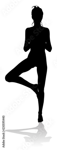 A silhouette of a woman in a yoga or pilates pose 