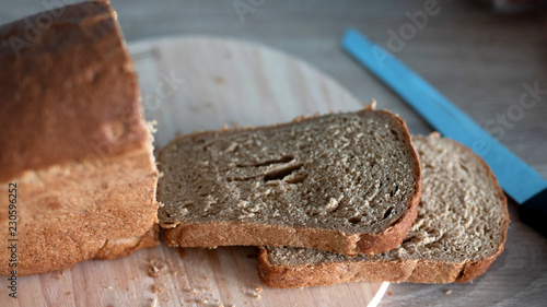sliced brown bread not a wooden Board © Olya