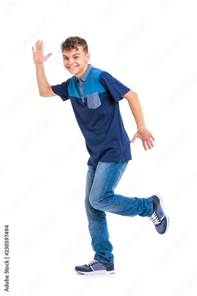 Full length portrait of young caucasian teen boy isolated on white  background. Funny teenager walking. Handsome active child running, looking  at camera and smiling. Stock Photo | Adobe Stock
