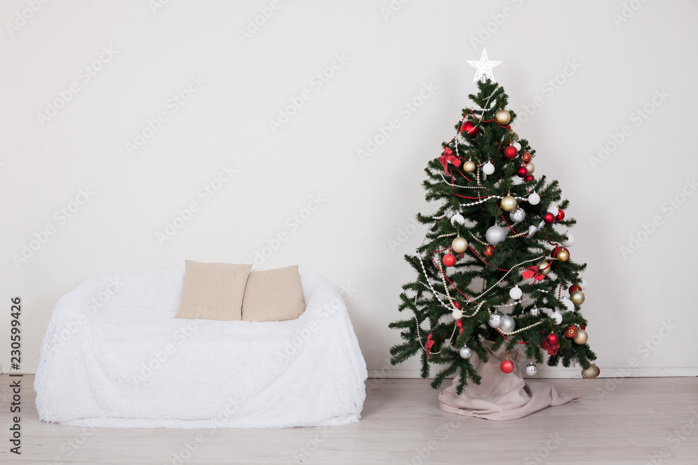 Christmas tree in the room with Christmas decorations and gifts toys