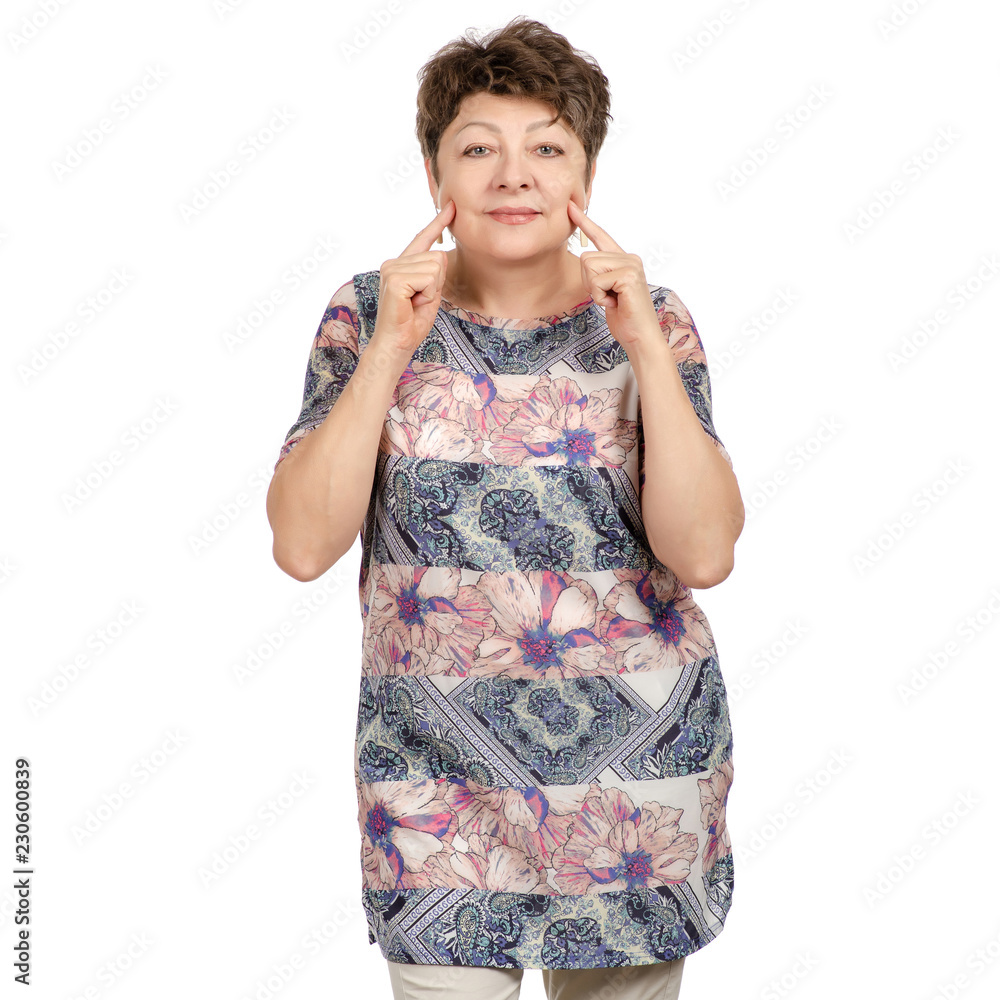 Beautiful woman aged smiling shows dimples on cheeks on a white background. Isolation Beautiful woman aged smiling shows dimples on cheeks on a white background. Isolation