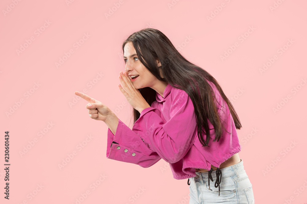 Secret, gossip concept. Young woman whispering a secret behind her hand. Business woman isolated on trendy pink studio background. Young emotional woman. Human emotions, facial expression concept. Secret, gossip concept. Young woman whispering a secret behind her hand. Business woman isolated on trendy pink studio background. Young emotional woman. Human emotions, facial expression concept.