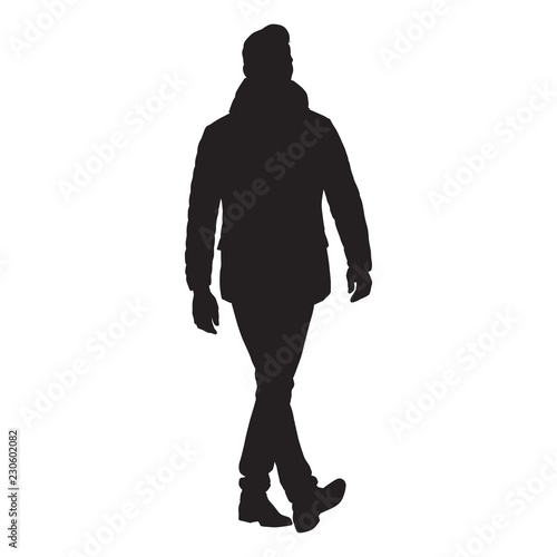 Business man walking forward in winter clothing, isolated vector silhouette