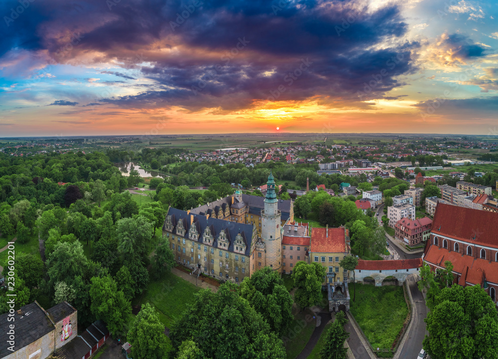 Oleśnica castle with city panorama at the sunset aerial view