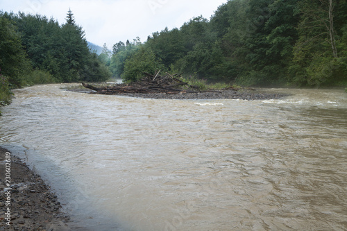 Beautiful mountain river in cloudy weather in the European Chati world. The flood of rain. Stock photo for design photo