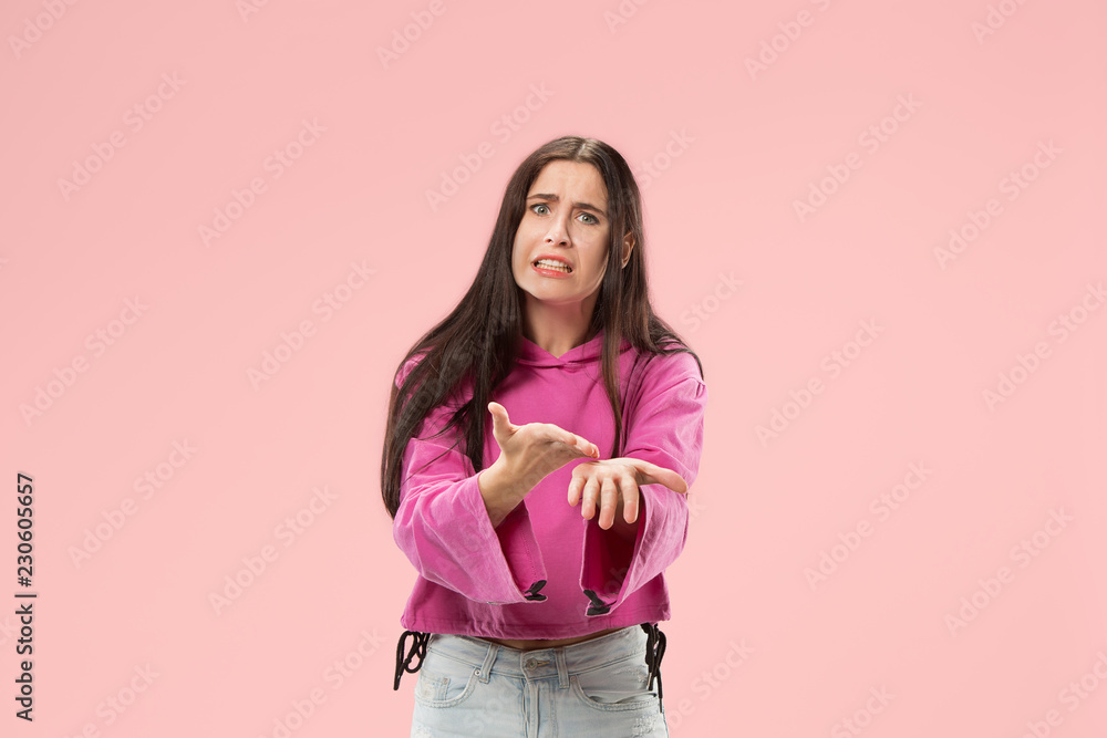 Argue, arguing concept. Beautiful female half-length portrait isolated on pink studio backgroud. Young emotional surprised woman looking at camera.Human emotions, facial expression concept. Argue, arguing concept. Beautiful female half-length portrait isolated on pink studio backgroud. Young emotional surprised woman looking at camera.Human emotions, facial expression concept.