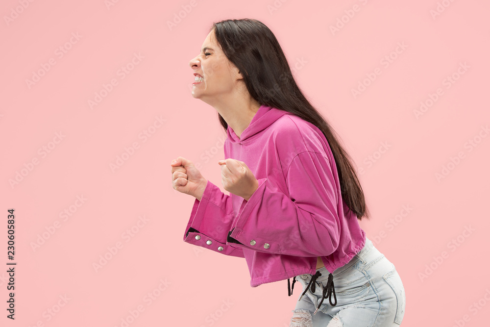 I won. Winning success happy woman celebrating being a winner. Dynamic image of caucasian female model on pink studio background. Victory, delight concept. Human facial emotions concept. Trendy colors I won. Winning success happy woman celebrating being a winner. Dynamic image of caucasian female model on pink studio background. Victory, delight concept. Human facial emotions concept. Trendy colors