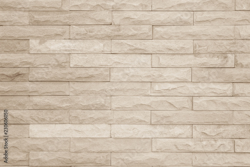 Seamless cream pattern of decorative brick sandstone wall surface with concrete of modern style design decorative uneven have cracked realmasonry wall of multicolored stones or blocks with cement.