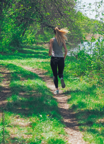 Obraz na płótnie Young girl running at the forest happy w salonie