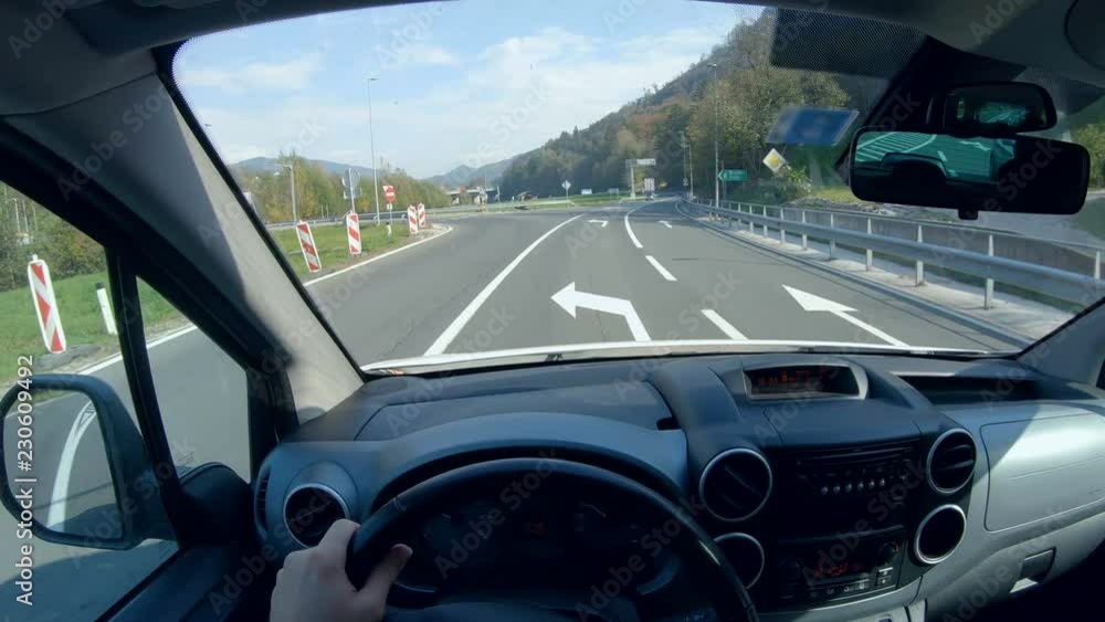 Driver POV turn left towards the highway access 4K. Driver point of ...