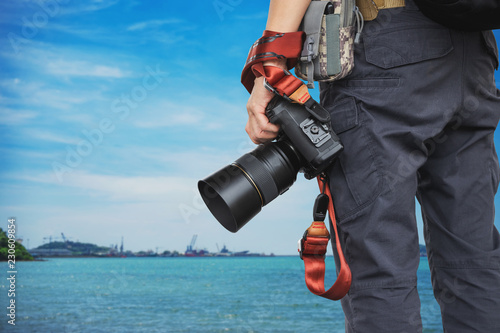 Close-up shot of man holding camera