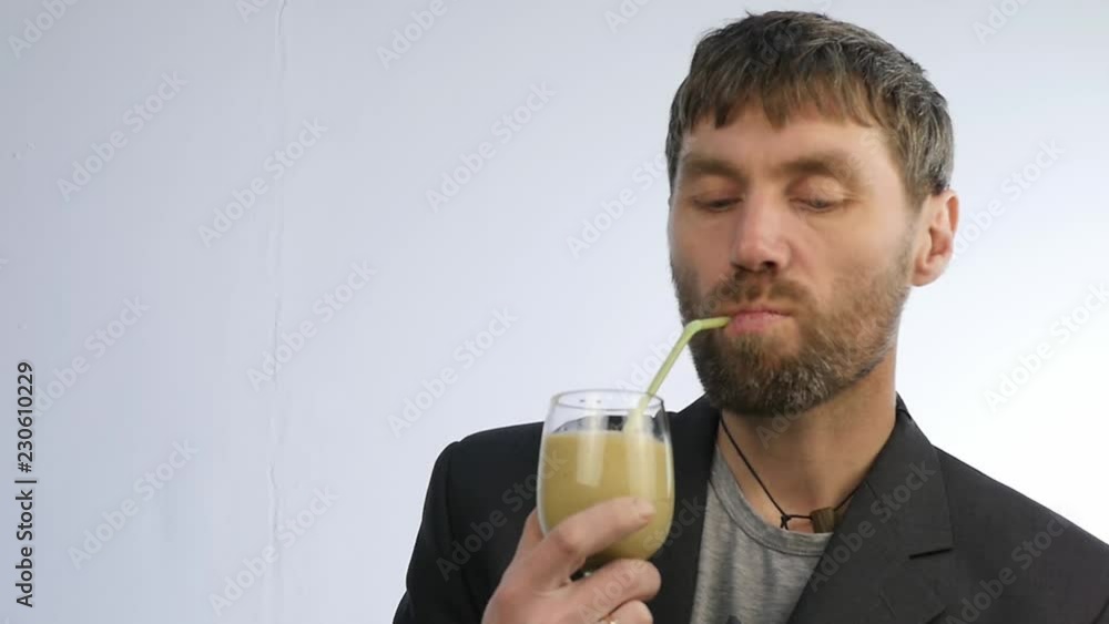 bearded man drinks detox smoothie, healthy lifestyle concept. cocktail from vegetable and fruit. slow motion bearded man drinks detox smoothie, healthy lifestyle concept. cocktail from vegetable and fruit. slow motion