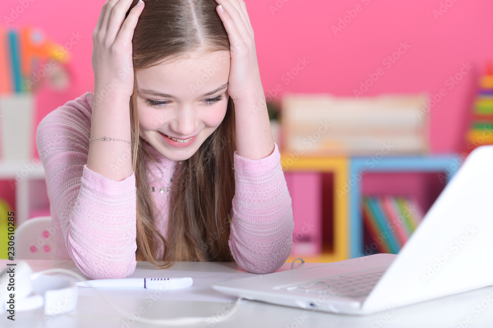 Portrait of a beautiful cute girl using laptop Portrait of a beautiful cute girl using laptop