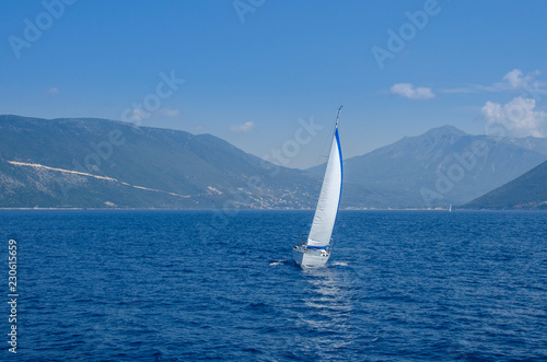Yacht sailing in blue sea