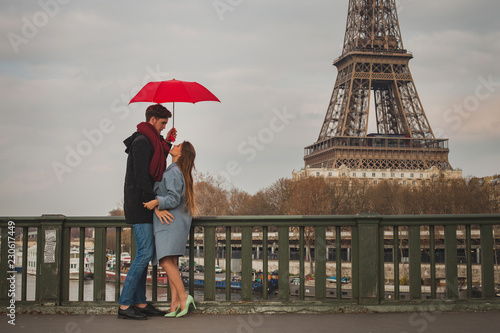 Photography romantic couple in Paris near Eiffel tower in autumn, dating, man and woman kiss