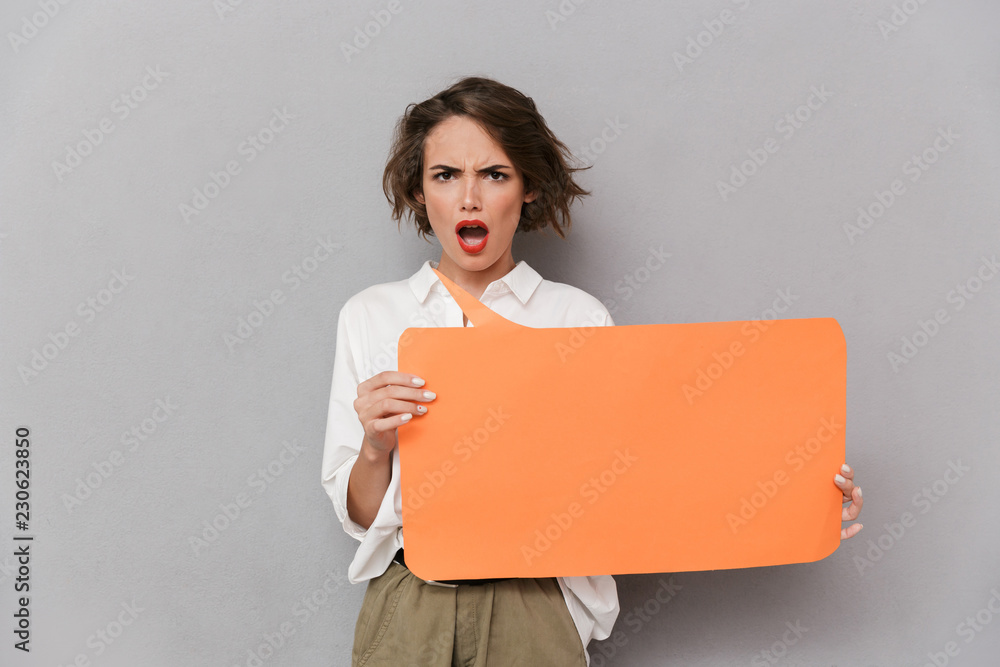 Portrait of a mad young woman standing Portrait of a mad young woman standing