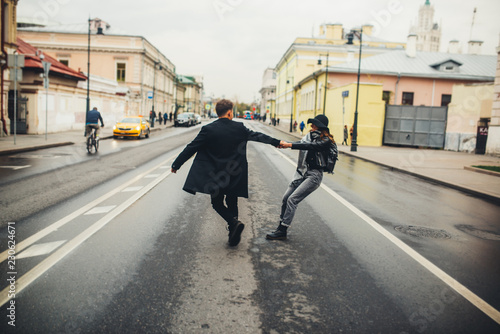 young couple walks on the city © Kirill