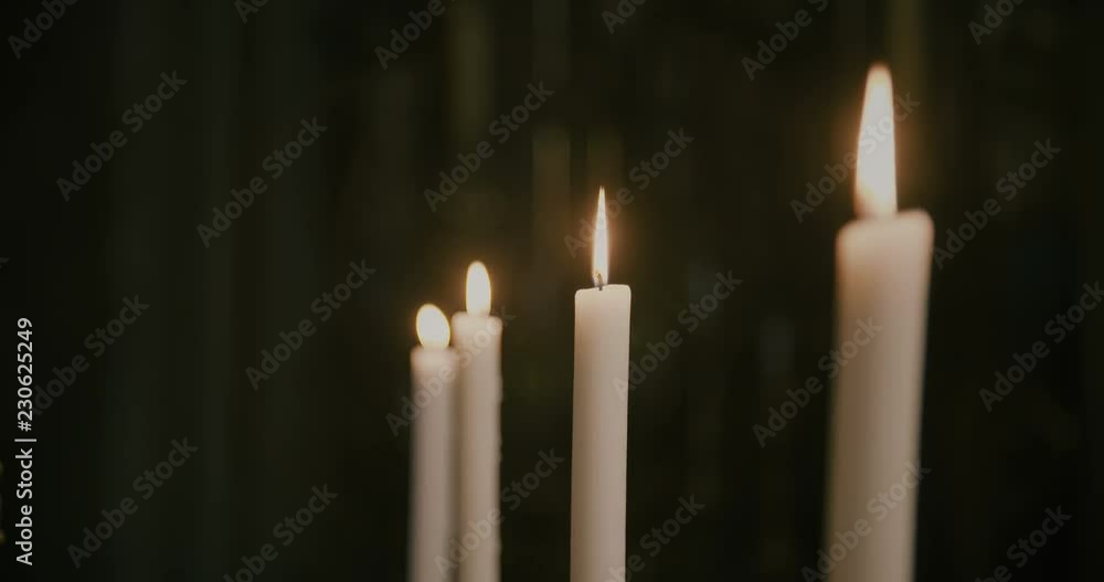 Four wax candles in the church. Four wax candles in the church.